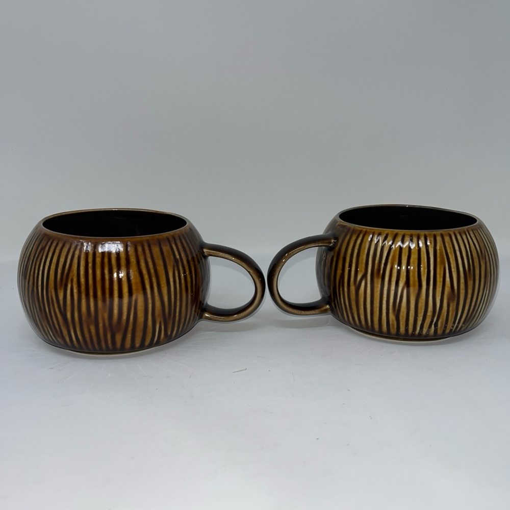 The Starbucks Set of 2 brown Tiki Mugs 12fl oz. 2013 limited Edition